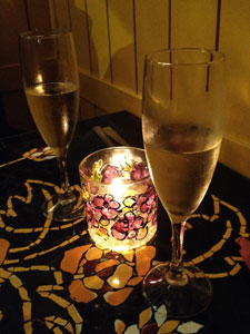 candle and wine glasses